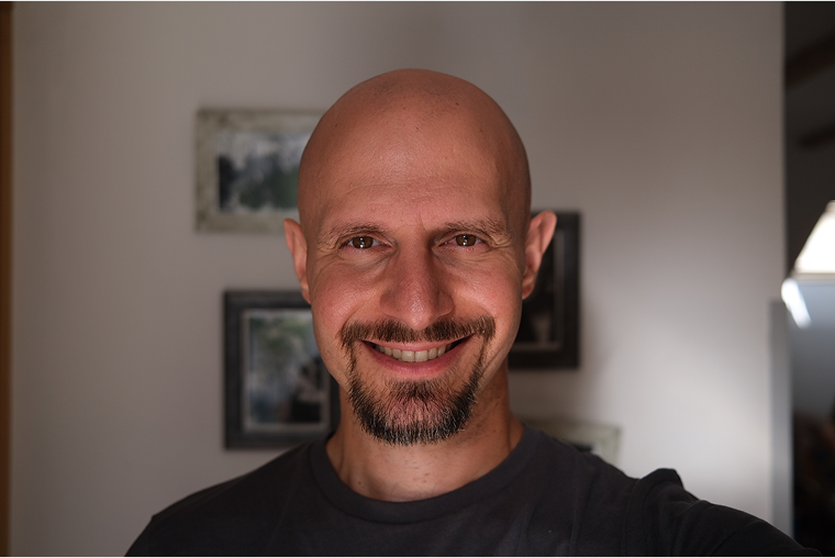 Portrait of Pantelis Orfanos in low warm light